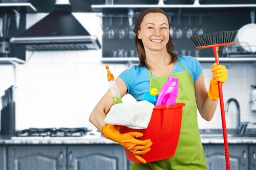Cleaner maintaining a shared apartment entrance in Kingston upon Thames