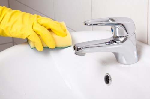 Cleaning a fresh kitchen ready for move-in in Kingstonuponthames