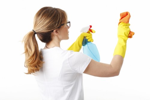 Cleaner preparing carpet cleaning equipment in a Kingston upon Thames property