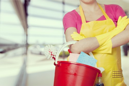 Cleaner preparing a guest-ready bedroom in Kingston upon Thames