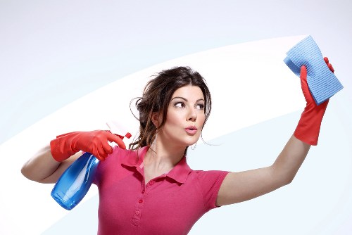 Local office cleaner maintaining a meeting room in Kingstonuponthames